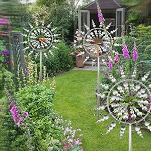 Image of 3 windmills in a garden